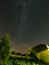 night stars and milky way galaxy above slovakian village