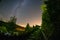 night stars and milky way galaxy above slovakian village