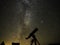 Night stars and nebulas observing over telescope