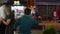 Night Street Food. Evening cafe. A man, a restaurant employee awaits visitors