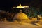 Night street scene in the old town, dome of the ancient thermal bathhouse, illuminated Narikala Fortress, Tbilisi