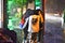 At night, a sudden downpour, three middle school students used their tops to block their heads and walked in the rain.