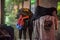 At night, a sudden downpour, three middle school students used their tops to block their heads and walked in the rain.