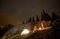 Night summer camping in the mountains under night starry sky