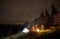 Night summer camping in the mountains under night starry sky