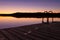 Night swim dock and calm lake at twilight
