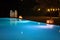 Night swimming pool and candles