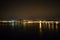 Night Tejo river. 25thth April bridge. Lisbon. Almada. Portugal. Nightscene. lights  colors dark background. landscape