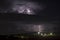 Night thunderstorm over the city, Sardinia, Italy