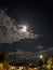 Night time city of Los Angeles captured under the light of a full moon.