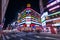 night time landscape street view with traffic on street around taipei main station shopping area with background of building with