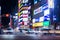night time landscape street view with traffic on street around taipei main station shopping area with background of building with