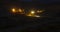 Night time lapse excavators and trucks work in quarry