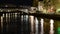 Night time lapse of trains moving across the bridge on Spree in Berlin Germany