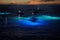 Night time manta ray snorkel and dive tour boats off the Kona Coast in Hawaii.