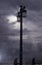 Night time sky with navy clouds and street lamp