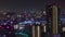 A night timelapse of building lights in Osaka telephoto shot
