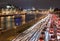 Night traffic along a city river in Moscow