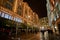 Night traffic and street scenery in a typical rainy day in United kingdom near Harrods Department Store in London. Night urban