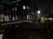 Night trip in the dark between the canals and the busy streets of amsterdam