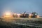 Night unloading grain from the combine in the field