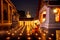 Night Urban City Skyline of Landmark Bangkok. Wat Saket. Night scene of Phu Khao Thong Golden Mountain and monk reading a book