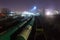 Night view from above on the railway. Commodity trains, freight wagons and cisterns