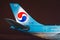 Night view of the airport and the tail plane Korean air. Russia, Saint-Petersburg April 2017.