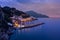 Night view of Amalfi cityscape on coast of mediterranean sea, Italy