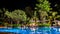 Night view of beautiful swimming pool in tropical resort