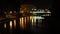 Night view of the Brda River and the buildings of the Old Town in Bydgoszcz, with a bridge on Mostowa street