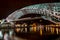 Night view of The Bridge of Peace over river Kura