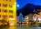 Night view of Brig street with Christmas tree on background of Alps, Switzerland