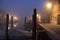 Night view canal on Murano island in the fog