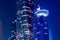 Night view on the centre of the city Doha with many modern luxury building and skyscrapers illuminated with numerous lights