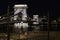 Night view of the Chain Bridge with cyclists walking the streets of Budapest, Hungary