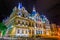 Night view of the chamber of commerce building in Lyon, France