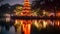 Night view of the Chinese pagoda at the lake in Hangzhou, China, Tran Quoc pagoda in Ha Noi capital of Vietnam, AI Generated