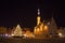 Night view of the Christmas tree near medieval The Tallinn Town Hall. Built in XIV century and firstly mentioned as consistorium