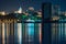 Night View of the city of Khabarovsk from the Amur river. Blue night sky. The night city is brightly lit with lanterns. The level