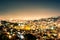 Night view cityscape of caracas during summer clear sky with view of hills with the slums, so called barrios