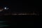 Night view from container terminal in port Kwangyang on illuminated suspension Yi Sun-sin Bridge.