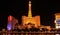 : Night view of the dancing fountains of Bellagio and the Eiffel Tower replica