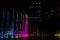 Night view of the dancing multi-colored fountains. Show of Singing Fountains