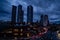 Night view of Deansgate Square with four skyscraper towers under the cloudy sky