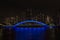 Night view of the Eitai Bridge over the Sumidagawa river, with tall buildings behind, Tokyo