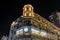 Night view of an elegant building adorned with vibrant lights