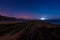 Night view of the flysch with low tide and full moon light in Zumaia