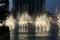 Night view fountains downtown and in a man-made lake, Dubai UAE