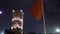 Night view on Hassan tower from the square with lanterns and Flags in Rabat, Morocco. Unfinished mosque minaret